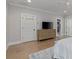 Bedroom featuring hardwood floors, dresser, and a walk-in closet with great storage at 357 Mell Ne Ave, Atlanta, GA 30307