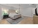 Comfortable bedroom featuring hardwood floors, and a large bed with bedside tables at 357 Mell Ne Ave, Atlanta, GA 30307