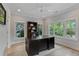 Home office featuring hardwood floors, natural light and large dark wood desk at 357 Mell Ne Ave, Atlanta, GA 30307