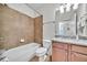 Cozy bathroom with neutral tile, vanity and tub/shower combination at 3676 Brookhaven Manor Ne Xing, Atlanta, GA 30319