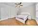 Bedroom with hardwood floors, a ceiling fan, and a closet at 3676 Brookhaven Manor Ne Xing, Atlanta, GA 30319