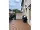 Exterior view from the deck features a barbecue, brick wall, and elegant architectural details at 3676 Brookhaven Manor Ne Xing, Atlanta, GA 30319