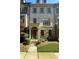 Charming multi-story townhouse featuring a stone and brick facade and well-maintained landscaping at 3676 Brookhaven Manor Ne Xing, Atlanta, GA 30319