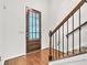 Inviting foyer with hardwood floors, staircase and front door, showcasing the home's entrance at 3676 Brookhaven Manor Ne Xing, Atlanta, GA 30319