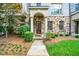 Beautiful stone and brick townhouse with a welcoming entrance and lush front lawn at 3676 Brookhaven Manor Ne Xing, Atlanta, GA 30319