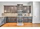 Stylish kitchen with stainless steel appliances, custom cabinets and granite countertops at 3676 Brookhaven Manor Ne Xing, Atlanta, GA 30319