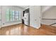 Kitchen features stainless steel refrigerator, custom cabinets and wood floors at 3676 Brookhaven Manor Ne Xing, Atlanta, GA 30319