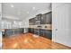 Charming kitchen features dark cabinets, stainless appliances, granite countertops, and tiled backsplash at 3676 Brookhaven Manor Ne Xing, Atlanta, GA 30319