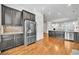 Open kitchen features stainless steel appliances, custom cabinets, granite countertops and mosaic backsplash at 3676 Brookhaven Manor Ne Xing, Atlanta, GA 30319