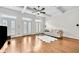 Bright living room featuring hardwood floors, coffered ceilings, and lots of natural light at 3676 Brookhaven Manor Ne Xing, Atlanta, GA 30319