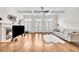 Bright living room with hardwood floors, fireplace, and coffered ceilings offers lots of space and natural light at 3676 Brookhaven Manor Ne Xing, Atlanta, GA 30319