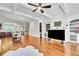 Open-concept living room with hardwood floors flows into the kitchen and dining area, creating a welcoming space at 3676 Brookhaven Manor Ne Xing, Atlanta, GA 30319