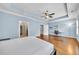 Spacious main bedroom with hardwood floors, a tray ceiling, and a ceiling fan offers lots of light at 3676 Brookhaven Manor Ne Xing, Atlanta, GA 30319