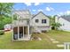Backyard view of the two-story home featuring a porch, deck and patio at 4258 Anderson Ridge Way, Austell, GA 30106