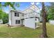 Spacious backyard with a deck, white siding, and a well-maintained lawn, perfect for outdoor activities and relaxation at 4258 Anderson Ridge Way, Austell, GA 30106