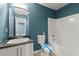 Bathroom featuring a white vanity and tub with shower at 4258 Anderson Ridge Way, Austell, GA 30106