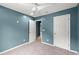 Bedroom featuring soft carpet, ceiling fan, and white doors leading to other rooms at 4258 Anderson Ridge Way, Austell, GA 30106