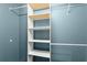 Walk-in closet with shelving and hanging rods for organized storage at 4258 Anderson Ridge Way, Austell, GA 30106
