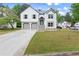 Charming two-story home with a well-manicured lawn, a two-car garage, and a inviting entrance at 4258 Anderson Ridge Way, Austell, GA 30106