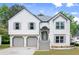 Charming two-story home featuring a two-car garage, well-maintained lawn, and inviting front entrance at 4258 Anderson Ridge Way, Austell, GA 30106