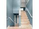 View of foyer with tile flooring, staircase with white railings and blue accent walls at 4258 Anderson Ridge Way, Austell, GA 30106