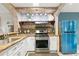 Updated kitchen with modern appliances, white cabinets, and granite countertops at 4258 Anderson Ridge Way, Austell, GA 30106