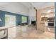 View of the spacious living room with a fireplace, tile floor and a screened-in porch at 4258 Anderson Ridge Way, Austell, GA 30106