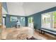 View of the spacious living room with a tile floor, natural lighting, and a screened-in porch at 4258 Anderson Ridge Way, Austell, GA 30106