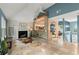 View of the spacious living room with a fireplace, brick arch and a tile floor at 4258 Anderson Ridge Way, Austell, GA 30106