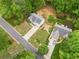 This is an aerial shot of the property, highlighting its location, yard, and nearby streets at 5525 Tallantworth Trl, Cumming, GA 30040
