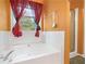 Primary bathroom with soaking tub and a separate stand-up shower at 5525 Tallantworth Trl, Cumming, GA 30040