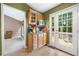 Eat-in kitchen features wood cabinets, tile floors, and access to the deck through glass paneled doors at 5525 Tallantworth Trl, Cumming, GA 30040