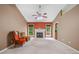 Inviting living room with fireplace, ceiling fan, and neutral carpet at 5525 Tallantworth Trl, Cumming, GA 30040