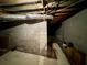 Unfinished basement with concrete floor, exposed beams, utilities, and block wall foundation at 880 Havenridge Dr, Conyers, GA 30094