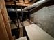 Unfinished basement with utilities and foundation support beams at 880 Havenridge Dr, Conyers, GA 30094