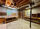 Unfinished basement offers storage space, workbenches, and natural light at 880 Havenridge Dr, Conyers, GA 30094