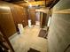 Basement area showing concrete floor and wood paneled walls at 880 Havenridge Dr, Conyers, GA 30094