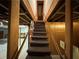 Basement stairway with carpet and wooden handrails at 880 Havenridge Dr, Conyers, GA 30094