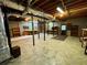 Unfinished basement with concrete floor, exposed beams, utilities, and block wall foundation at 880 Havenridge Dr, Conyers, GA 30094