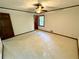 Large bedroom features neutral carpeting and a ceiling fan at 880 Havenridge Dr, Conyers, GA 30094