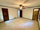 Large empty bedroom with neutral carpet and a ceiling fan at 880 Havenridge Dr, Conyers, GA 30094