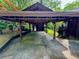 Covered carport attached to the home with views into the backyard at 880 Havenridge Dr, Conyers, GA 30094