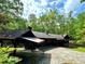 Exterior view of the home and two-car garage with car port at 880 Havenridge Dr, Conyers, GA 30094