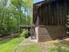 Wooden deck off side of home overlooking yard with a brick and wood exterior at 880 Havenridge Dr, Conyers, GA 30094