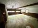 Spacious two-car garage with concrete floor, brick accent wall, and natural light from two garage doors at 880 Havenridge Dr, Conyers, GA 30094