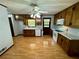 Traditional kitchen featuring wood cabinets, laminate countertops, and a ceiling fan with light fixture at 880 Havenridge Dr, Conyers, GA 30094