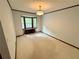 Carpeted living room with a bay window that lets in natural light to make the room bright at 880 Havenridge Dr, Conyers, GA 30094