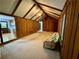 Open living room with hardwood flooring flowing into the living room with its wood-paneled walls and vaulted ceilings at 880 Havenridge Dr, Conyers, GA 30094