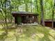 Exterior of additional outbuilding on property in wooded area at 880 Havenridge Dr, Conyers, GA 30094