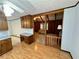 Open view from the kitchen into the living room with a glimpse of the vaulted ceiling and wood-paneled walls at 880 Havenridge Dr, Conyers, GA 30094